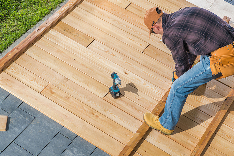 men building wooden deck on his backyard 2023 11 27 05 32 39 utc